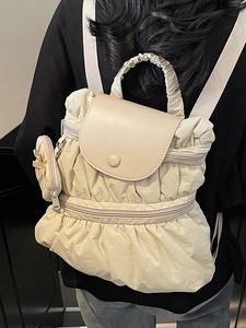 Chic cream pleated backpack for women with matching mini pouch and ruffled handle