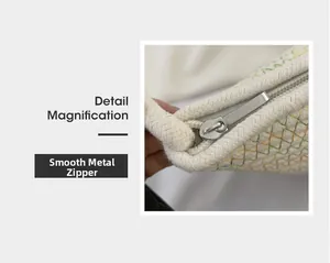 Detail magnification of smooth silver metal zipper on woven floral bucket bag for women