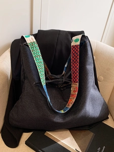 Bohemian denim tote bag with colorful ethnic print straps and drawstring closure