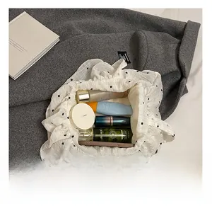 Internal view of a floral ruffle tote bag showing large capacity for cosmetics