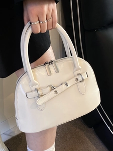 Minimalist beige shell bag in glossy leather with silver ring buckle and double handles