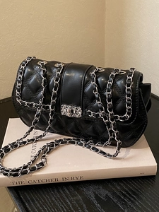 Chic quilted black leather crossbody bag with silver chain strap and metal swivel lock