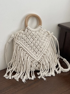 Bohemian off-white hand-woven shoulder bag with wooden handles and fringe tassels