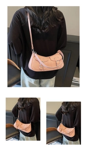 Pink Y2K shoulder bag with front buckle pockets and adjustable strap detail view