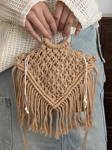 Bohemian hand-woven hemp rope tote bag with wood ring handles and tassel details