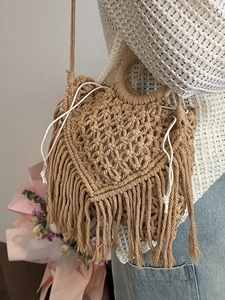 Bohemian handwoven crossbody bag with heart pattern, wooden handle and tassels
