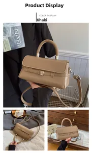 Detail view of khaki leather crossbody bag with silver buckle and matte finish