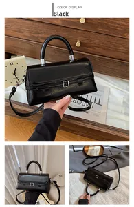 Macro detail of black square handbag with glossy pleated leather and silver metal buckle