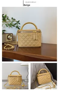 Close-up of beige quilted crossbody bag featuring a golden camellia flower and metal handle