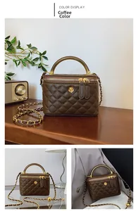 Close-up of brown quilted bucket bag with gold handle, flower ornament and dual zippers