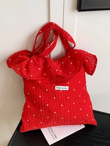 Red ruffle chiffon tote bag with white floral embroidery and Magic Pocket woven label