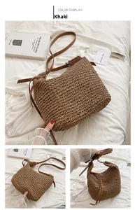 Detailed macro view of khaki straw tote bag with woven texture and leather strap