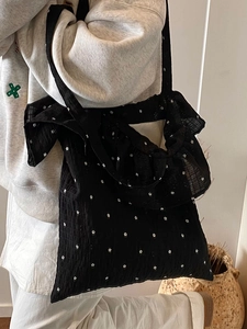 Black floral chiffon tote bag with ruffle trim and textured pleats for women
