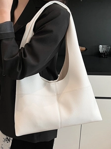 Minimalist white faux leather tote bag with pebble texture and large capacity for daily use