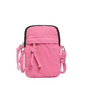 Pink washed denim mini crossbody phone bag with knot detail and black zipper