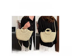 Detail showing versatile usage of the beige straw bag for both handbag and crossbody styles