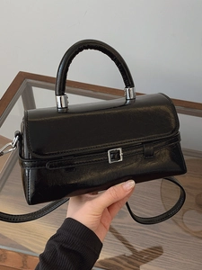 Fashionable black faux leather small square handbag with silver buckle and top handle