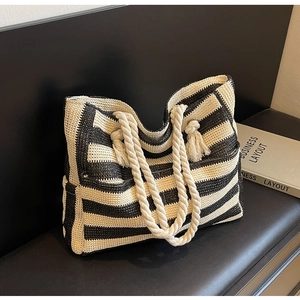 Detailed shot of black and white striped woven tote bag with cotton rope handles