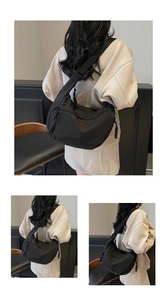 Detail of waterproof black nylon crescent bag with adjustable wide strap and braided zipper pull