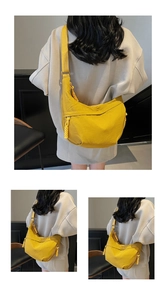 Detailed view of yellow crescent nylon crossbody bag with adjustable wide strap and woven cord zipper