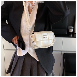 Detail of woven square bag in off-white leather with gold logo and crossbody strap