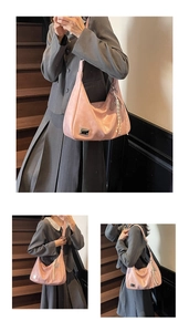 Pink crescent hobo bag detail with silver metal plate and cream woven tassel pendant