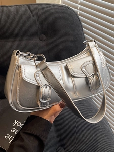 Metallic silver underarm bag with double front flap pockets and buckle details