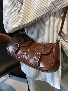 Deep brown glossy faux leather shoulder bag with double pockets and silver buckles