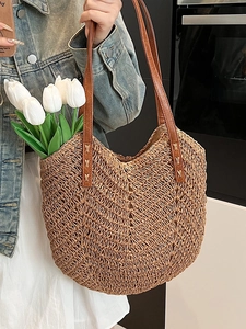 Chic woven straw tote bag with brown leather straps and V-shape crochet patterns