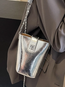 Silver metallic pleated mini bucket bag with chain strap and T-shaped buckle detail