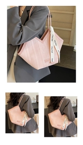Detail of pink tote bag featuring a V-shaped opening and decorative printed silk ribbon