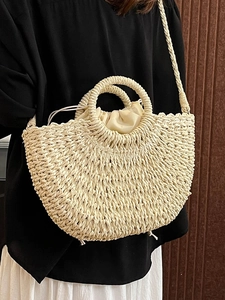Handwoven semicircular straw handbag in cream white with round handle and drawstring lining