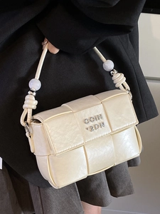 Chic off-white woven handbag with pearl handle and metal logo for casual business wear