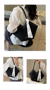 Detailed views of the black suede tote bag with V-cut opening and woven logo strap detailing