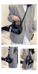 Detailed views of shiny black bowling bag showing texture, handles, and knot pendant