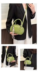Detail view of grass green patent leather bowling bag with stylish braided tassel detail