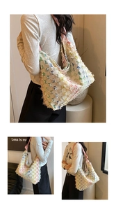 Detailed view of colorful tweed weave texture and frayed fringe edges on a hobo bag