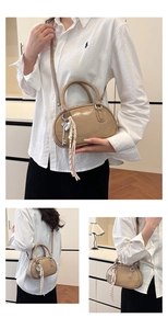 Three-way carry view of khaki patent leather bowling bag with glossy finish