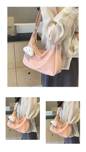 Detail of soft pink faux suede tote bag with a cute white cloud plush pendant charm