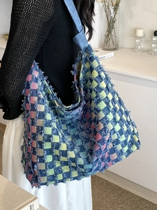 Large denim tote bag with colorful patchwork checkerboard pattern and fringe details