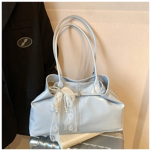 Light blue faux leather tote bag with lace and pearl bow charm for elegant styling