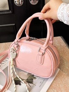 Chic pink Maillard style bowling bag with silver heart charm and crossbody strap