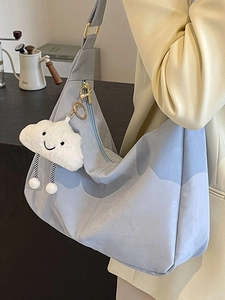 Light blue soft leather tote bag with cute cloud charm and spacious interior for women