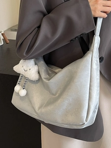Minimalist silver-grey soft leather tote bag with cloud plush pendant for women