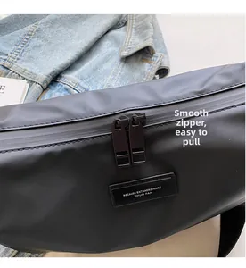 Detail showing smooth double metal zippers on the black matte fabric dumpling bag