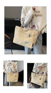 Detail view of beige canvas tote bag showing side woven label and durable stitching