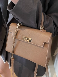 Elegant brown textured leather trapezoid handbag with gold twist lock for daily commuting