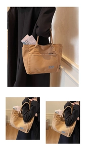 Detailed macro view of the durable brown canvas tote bag with TCT zipper pocket
