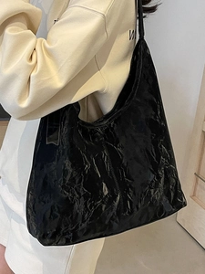Minimalist black crinkled leather tote bag with a high-shine finish for women's daily wear