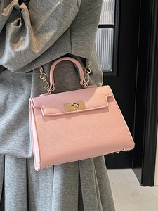 Elegant pink leather Kelly style handbag with gold lock hardware and chain strap